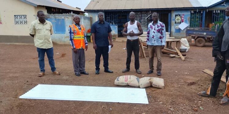 Nandom MP Supports 52 Rainstorm Victims with Roofing Sheets and Cement